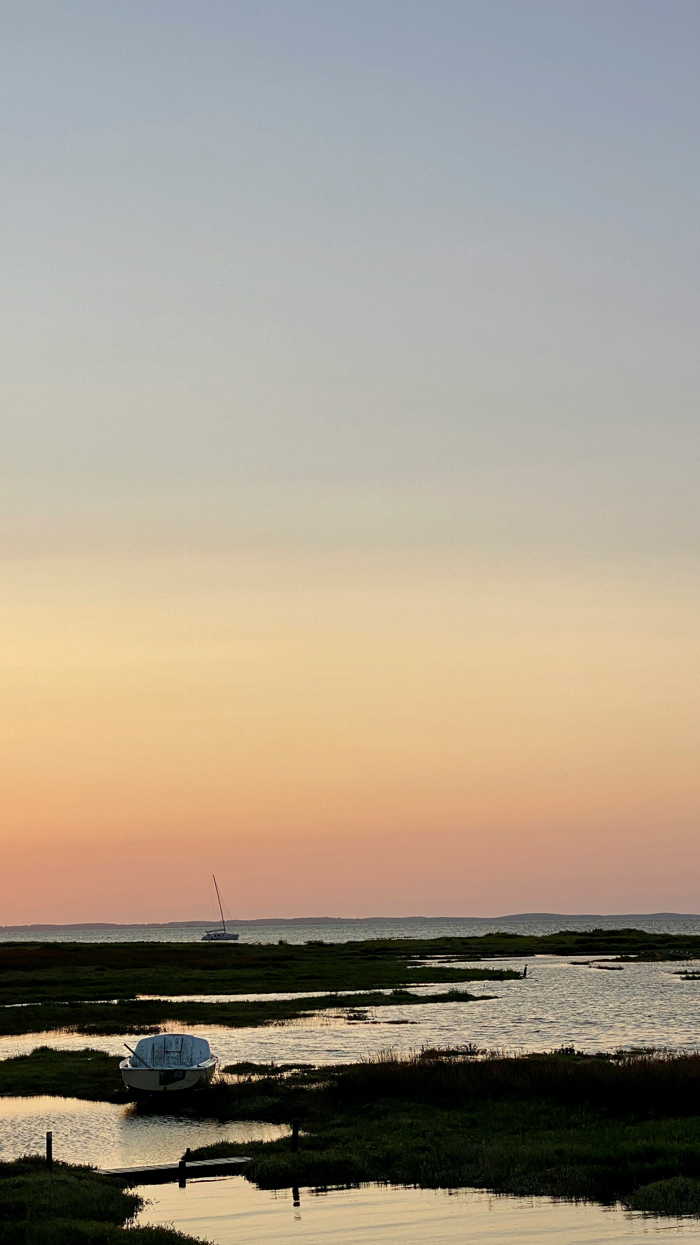 sailboat on sea during sunset